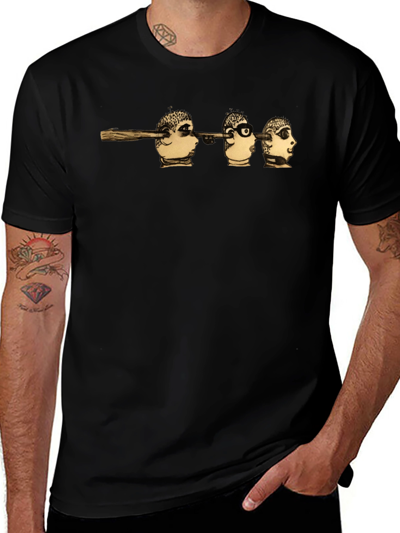 Surreal Head Skewer Graphic Tee - Black Cotton T-Shirt